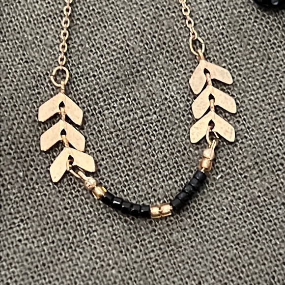 Dainty black and gold tone necklace and earring set. - Picture 2 of 3